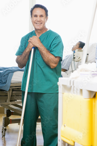 Photo: An Orderly Mopping The Floor In A Hospital Ward An Orderly Mopping The Floor In A Hospital Ward