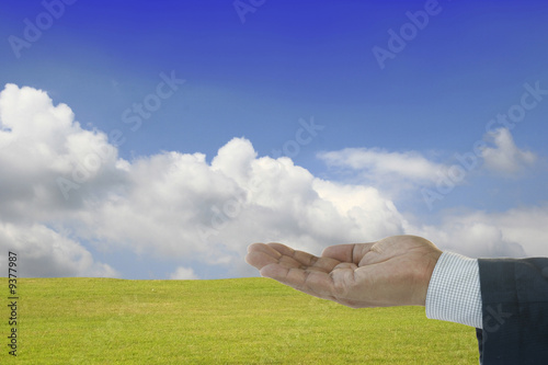 Foto: Upside hand concept in a spring landscape many uses concept Upside hand concept in a spring landscape many uses concept