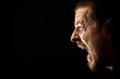 Angry man screaming in extreme rage