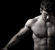 Muscular man with strong arms and nice abs