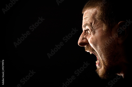 Photo : Angry man screaming in extreme rage Angry man screaming in extreme rage