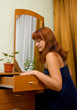 young woman searches for something in a pier glass box