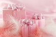 Three pink boxes wiht gift on the pink background