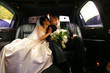 Kiss of a newly-married couple in car Kiss of a newly-married couple in car