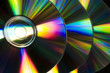 Photo: Compact discs raw reflecting ray of color Compact discs raw reflecting ray of color