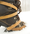 boot with crampons on an icy slope