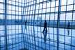 People silhouettes at business hall People silhouettes at business hall