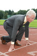 Businessman is ready for the start of his run.