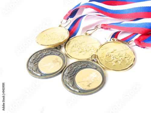 five golden hockey medals isolated on white five golden hockey medals isolated on white