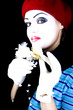 mime with a flower on a black background