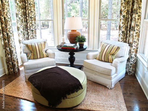  Chairs on Two Comfortable Overstuffed Chairs In A Luxury Sunroom    Digerati