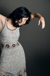 Portrait of young hispanic female dancer posing