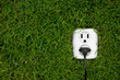 Photo: energy concept outlet in grass energy concept outlet in grass