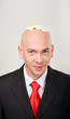 Portrait of smiling male with omelet on top of bald head