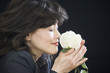 Foto: Businesswoman smelling rose Businesswoman smelling rose