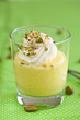 Delicious mango mousse topped with whipped cream Delicious mango mousse topped with whipped cream