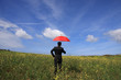 Business man with an umbrella symbolizing protection