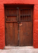 detail of red wall and wood door detail of red wall and wood door