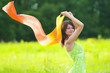 girl smiling with scarf in field girl smiling with scarf in field