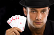 man with Royal Flush Poker Hand - isolated over a black