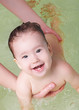 Foto: Joyful baby in swimming pool Joyful baby in swimming pool