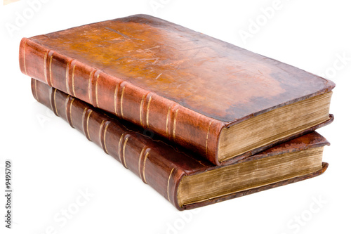 Two antique leather books isolated on a white background Two antique leather books isolated on a white background