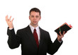 Spritual man in business suit with bible