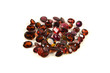 A group of mixed faceted garnets on a white background