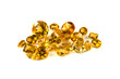 a grouping of mixed faceted citrine on a white background