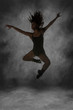 Young Street Dancer Leaping Mid Air With Dramatic Lighting