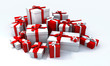 White gift box with red ribbon in the middle of a pile White gift box with red ribbon in the middle of a pile