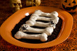 Halloween meringue bones on dirt (crashed Oreo Cookies)