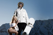 Macho snowboarder with adoring lingerie clad female fan