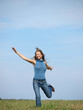 happy woman running in a field