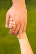 Photo: Father holding daughters hand Father holding daughters hand
