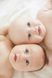 two pretty baby girls smiling portrait
