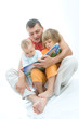 young father reading fairy tale to children