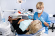 Photo en ligne au meilleur prix doctor works with patient in the dentist office