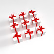 White gift boxes with red ribbons in a square formation White gift boxes with red ribbons in a square formation