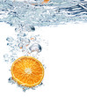 orange is dropped into water