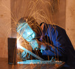 Factory welder doing his hard job