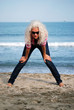 Blonde girl with glasses on a beach