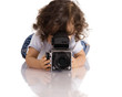 child with old SLR camera child with old SLR camera