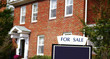 House for sale with sign in front