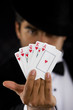 elegant man with Royal Flush Poker Hand - focus on cards