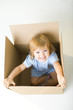 Happy young girl in box