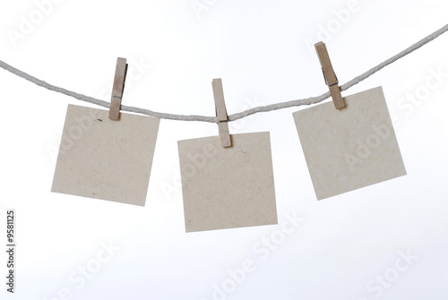 blank note cards are hanging to dry