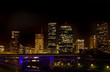 City Skyline at night with highway bridge in foreground