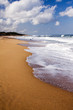 Photo: Foaming waves crashing onto the beach Foaming waves crashing onto the beach
