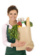 Photo: Shop Assistant Holding Grocery Bag Shop Assistant Holding Grocery Bag